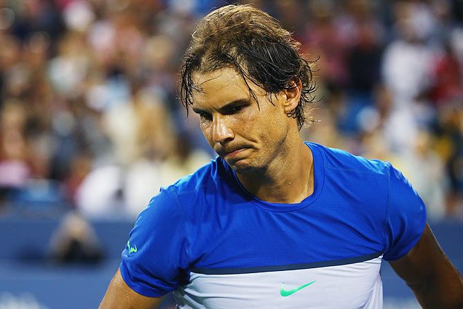 Spain's Rafael Nadal reacts after losing his match against compatriot Feliciano Lopez in round 3 of the Western & Southern Open at the Lindner Family Tennis Center in Cincinnati on Thursday