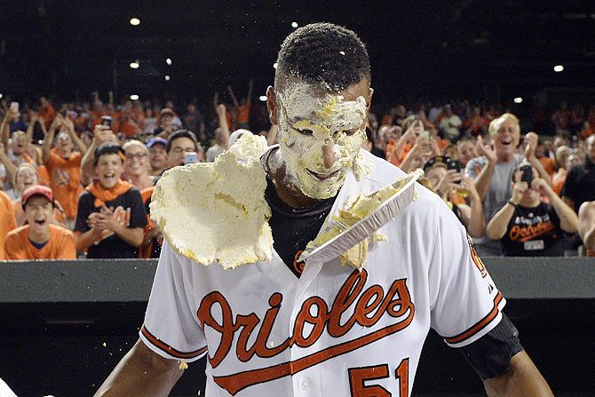 Baltimore Orioles' Henry Urrutia (51) is pied in the face after his walk off home run during the ninth inning against the New York Mets at Oriole Park at Camden Yards. Baltimore Orioles defeated New York Mets 5-4