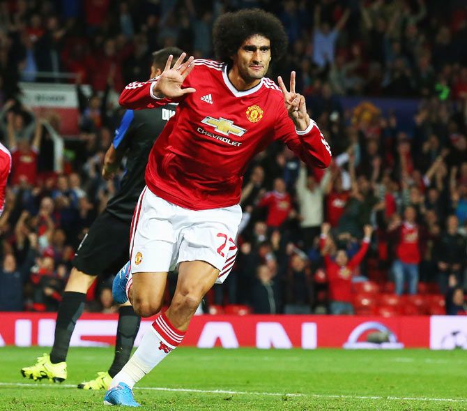 Manchester United's Marouane Fellaini celebrates scoring his team's goal against Club Brugge at Old Trafford during the UEFA Champions League Qualifying Round Play Off First Leg match on Wednesday