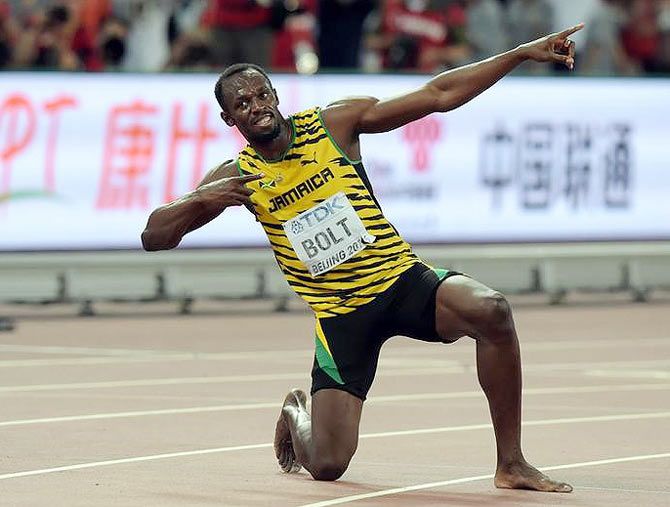 Usain Bolt (JAM) poses after winning the 200m in 19.55 during the IAAF World Championships in Athletics at National Stadium
