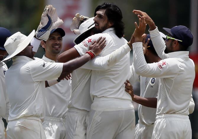Ishant Sharma (centre) celebrates with his team mates after taking the wicket of Lahiru Thirimanne