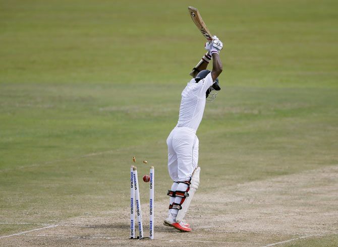 Sri Lanka's Kaushal Silva is bowled out by India's Umesh Yadav (not pictured) on Day 3 of their third and final Test match in Colombo on Sunday