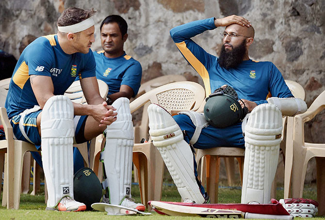 South African captain Hashim Amla with teammate Faf du Plesis during a practice sesion in New Delhi  