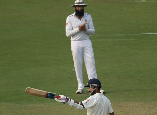 Ajinkya Rahane of India celebrates his fifty as South African captain Hashim Amla applauds his innings 