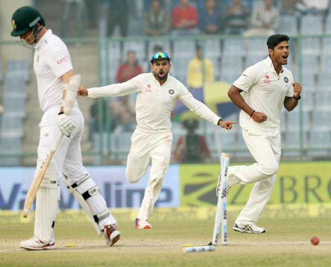 Indian players celebrate the dismissal of Kyle Abbott of South Africa during final day of the fourth Test match at Feroz Shah Kotla 