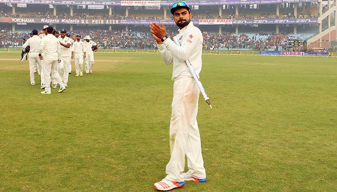 Indian captain Virat Kohli applauds the crowd following the win against South Africa at Ferozshah Kotla 