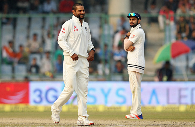 Shikhar Dhawan of India has a smile after a catch was dropped from his bowling 