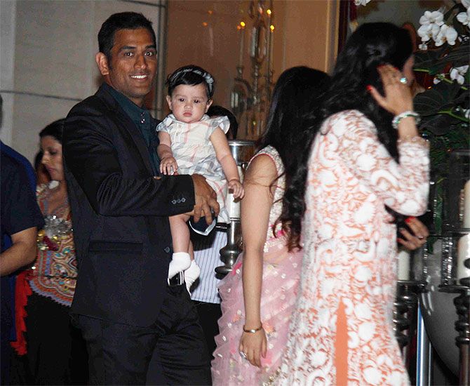 Mahendra Singh Dhoni with his daughter and wife