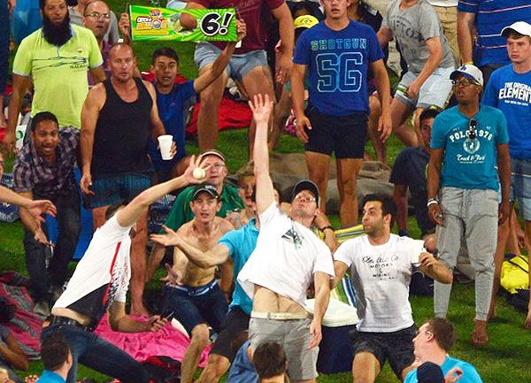 Fans attempt a one-handed catch during the Ram Slam T20 tournament in Centurion. South Africa on Saturday