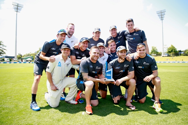 The New Zealand Black Caps pose with the series winning trophy 
