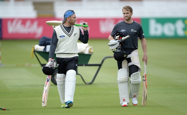 New Zealand captain Brendon McCullum and Kane Williamson walk across the outfield during a nets session 