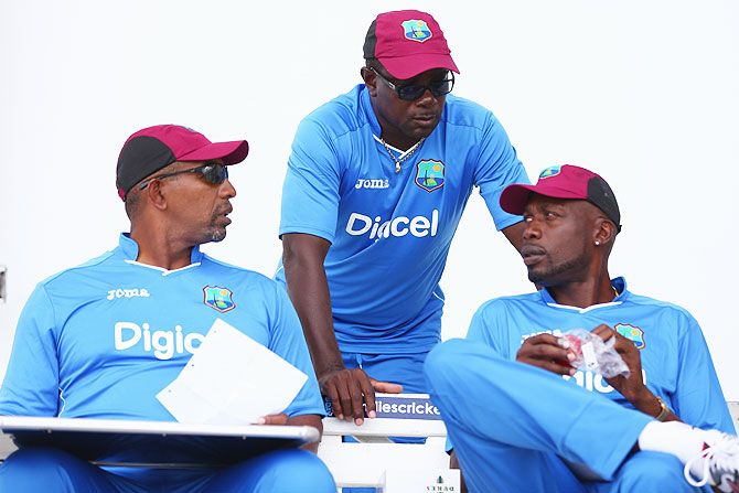 West Indies' head coach Phil Simmons (left), manager Richie Richardson (centre) and bowling coach Curtly Ambrose in conversation during a team nets session