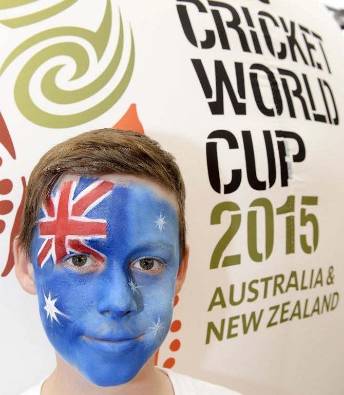 A young fan poses for a photo during the media opportunity as countdown begins for the 2015 ICC Cricket World Cup 