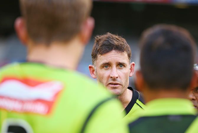 Mike Hussey of the Thunder talks to his teammates 
