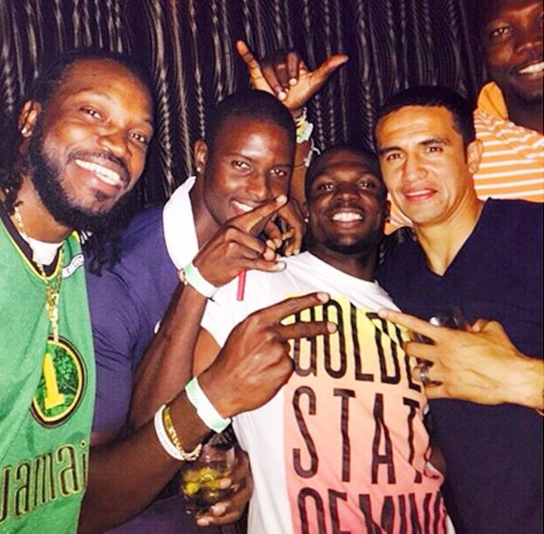 Chris Gayle with Tim Cahill
