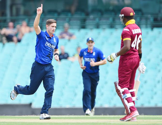 Chris Woakes of England celebrates after taking the wicket of Darren Bravo of West Indies during their ICC Cricket World Cup warm-up match at Sydney Cricket Ground on Monday