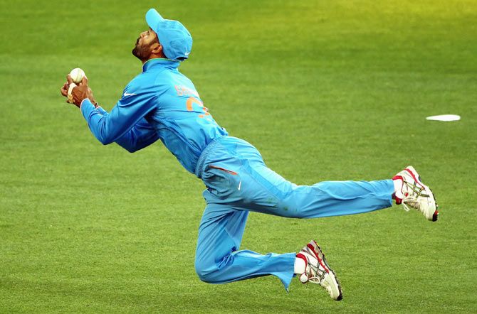 Shikhar Dhawan of India attempts to take a catch during the match against Afghanistan