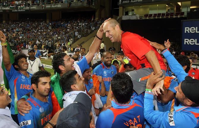 Gary Kirsten celebrates with his team after they beat Sri Lanka to win the 2011 ICC World Cup final 