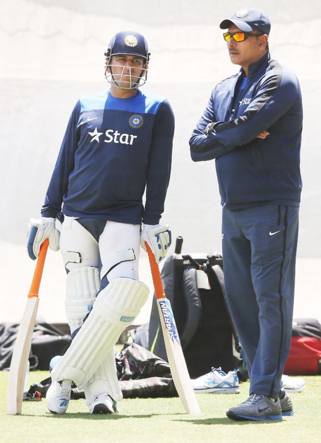 MS Dhoni talks to India Director of Cricket Ravi Shastri during a training session