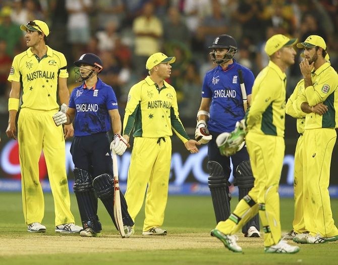 James Taylor of England looks on as Australia celebrate at the end of the 2015 ICC Cricket World Cup match between England and Australia at Melbourne Cricket Ground