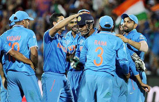 Team India players celebrate the wicket of Pakistan's Umar Akmal