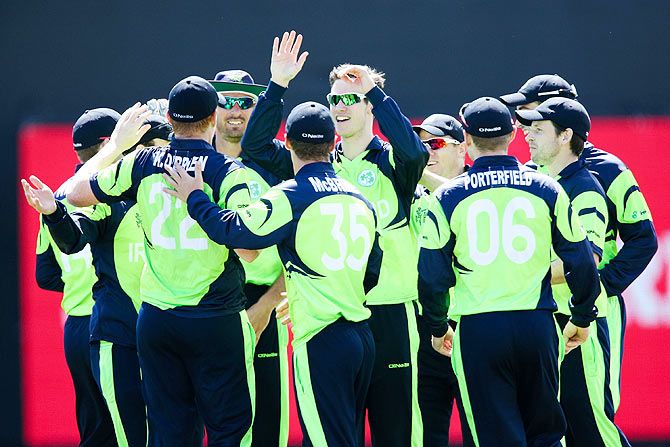 Ireland players celebrate the wicket of Chris Gayle of the West Indies during their 2015 ICC Cricket World Cup match at Saxton Field in Nelson, New Zealand, on Monday