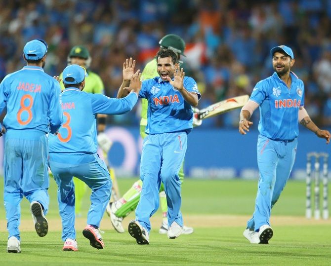India's Mohammed Shami celebrates with teammates 