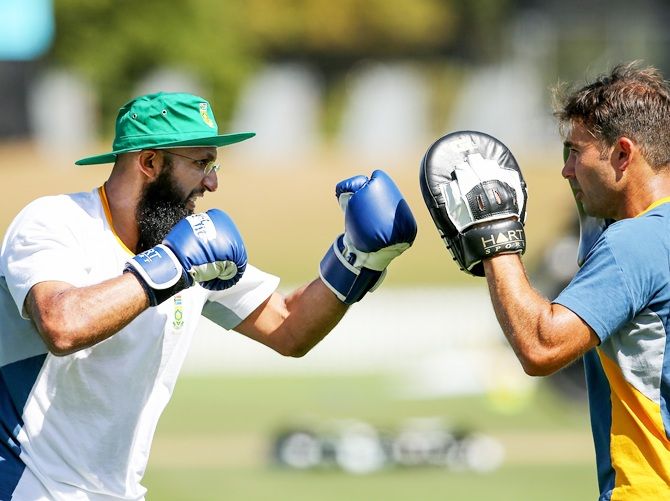 Hashim Amla of South Africa, left, boxes with fitness trainer Gregory King