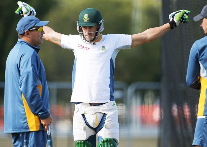 Faf du Plessis, centre, of South Africa stretchers prior to a South Africa pre-tournament Cricket World Cup nets session
