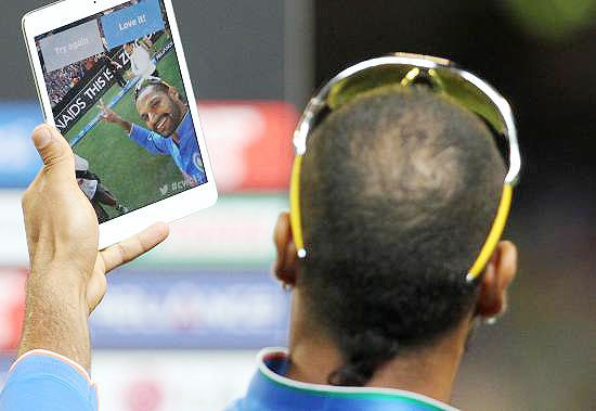 Indian batsman Shikhar Dhawan takes a selfie after India beat South Africa