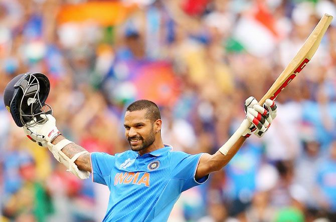 India's Shikhar Dhawan celebrates on completing his century against South Africa in their World Cup match at Melbourne Cricket Ground on Sunday
