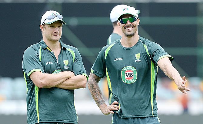 Shane Watson and Mitchell Johnson share a laugh during an Australian training session at The Gabba on February 19