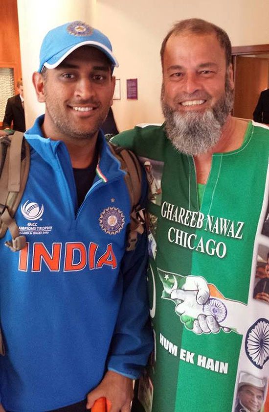 India captain Mahendra Singh Dhoni with Mohammad Bashir