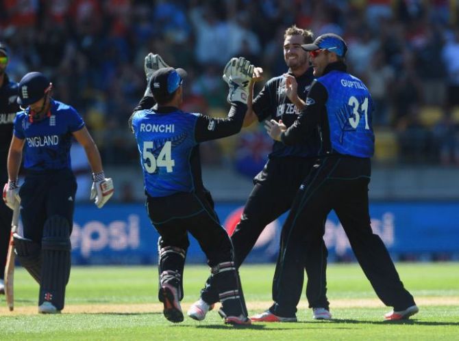 Tim Southee of New Zealand celebrates with team-mates after taking the wicket of James Taylor of England 