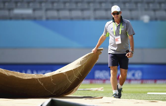 Mark Waugh, Australian Selector, inspects the pitch during an Australian Nets Session at Eden Park in Auckland on Thursday