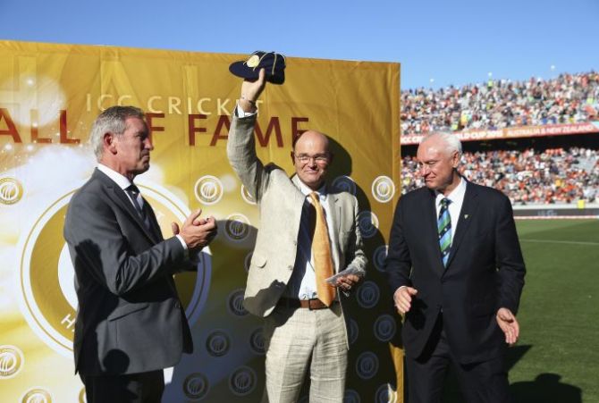 Martin Crowe, former New Zealand captain is inducted into the ICC Cricket Hall of Fame by ICC Director and Chairman of Cricket Australia, Wally Edwards during the World Cup match between Australia and New Zealand on February 28, 2015
