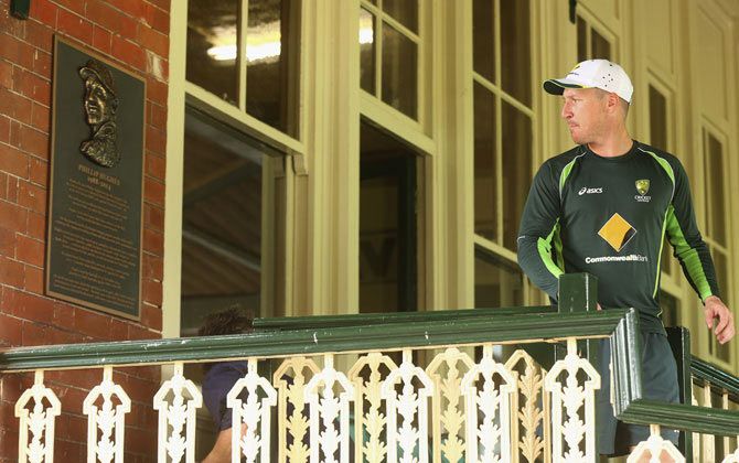 Australia wicket-keeper Brad Haddin walks past the commemorative plaque erected in a tribute to the late Phillip Hughes during a nets session at Sydney Cricket Ground