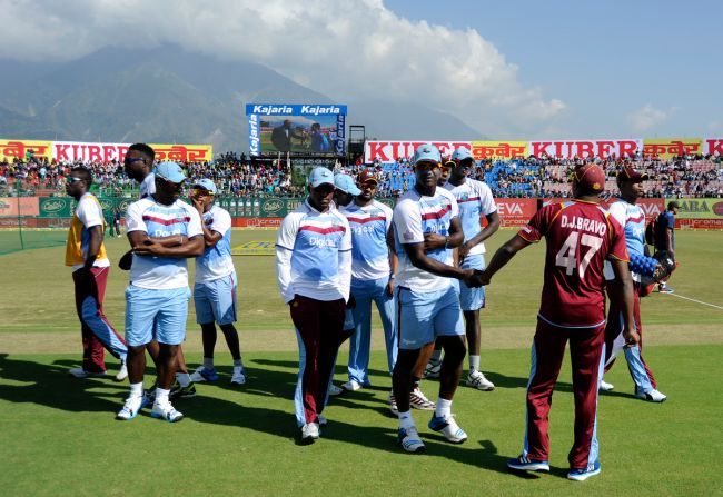 The West Indies players walk