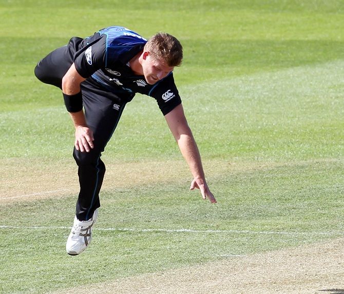 Corey Anderson of New Zealand attempts to field 
