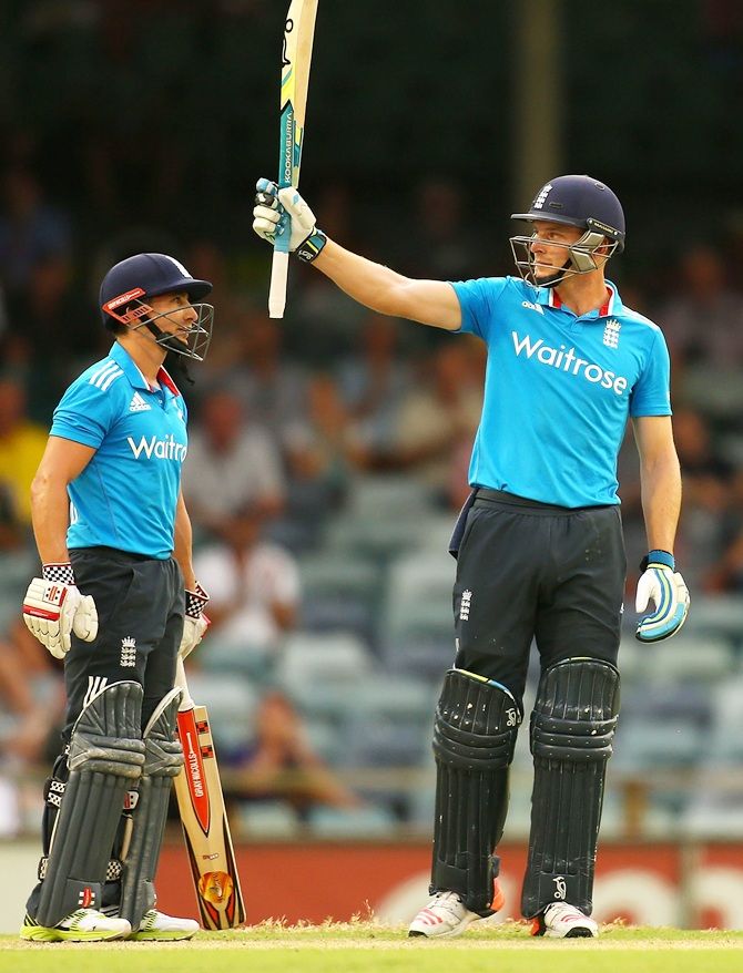 Jos Buttler of England celebrates his half century with James Taylor