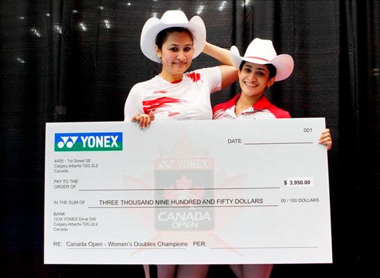 India's Jwala Gutta and Ashwini Ponnappa pose after winning the Canada Open women's doubles title in Calgary