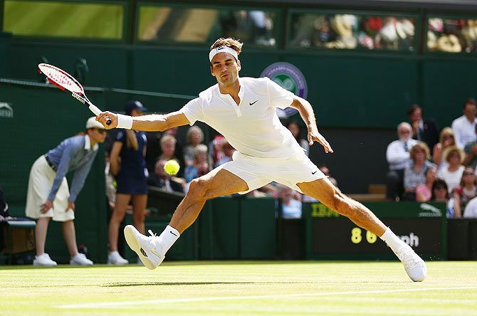Switzerland's Roger Federer plays a forehand in his Wimbledon third round match against Australia's Sam Groth on Saturday