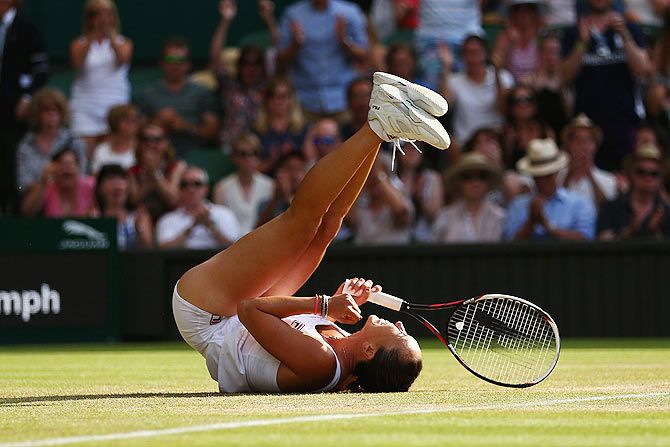 Serbia's Jelena Jankovic celebrates match point in her third round match against defending champion Czech Republic's Petra Kvitova at the Wimbledon Championships on Saturday