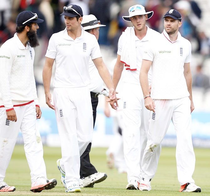 Moeen Ali, Alastair Cook, Stuart Broad and James Anderson of England leave the field