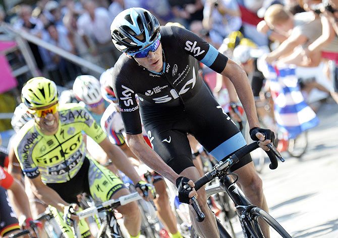 Team Sky rider Chris Froome of Britain climbs during the 159,5 km (99 miles) third stage of the 102nd Tour de France cycling race from Anvers to Huy, Belgium, on Monday