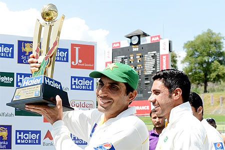  Pakistan captain Misbah-ul-Haq celebrates with the trophy after defeating Sri Lanka in the 3rd Test in Pellekele and clinch the Test series 2-1 on Tuesday