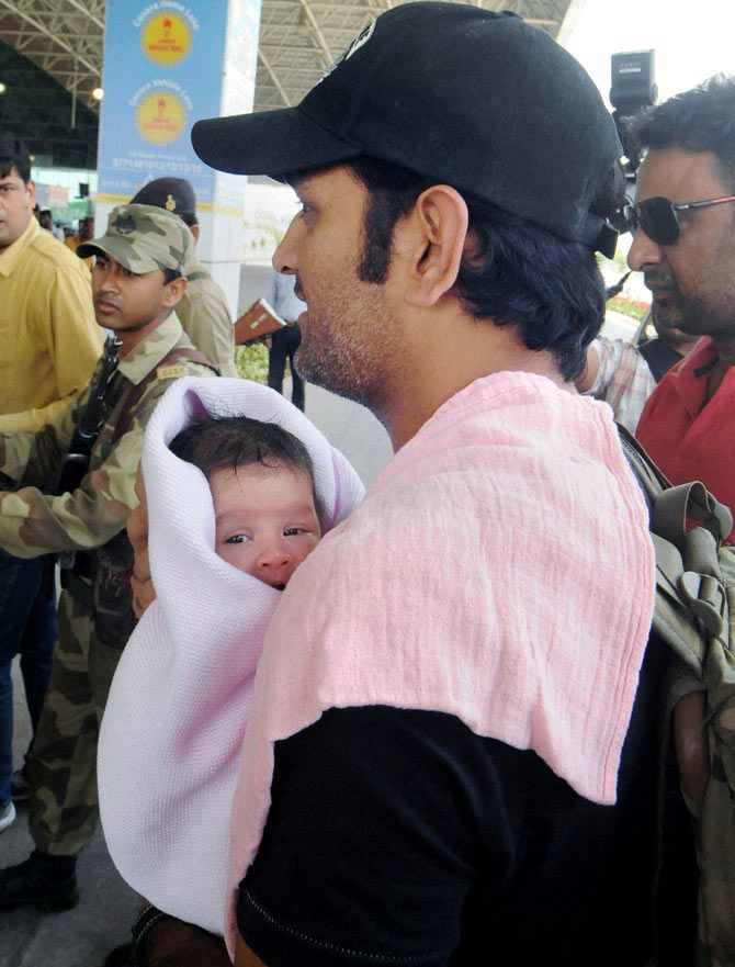 Mahendra Singh Dhoni with his daughter, Ziva, at Birsa Munda International Airport, in Ranchi