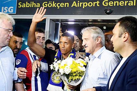 Nani acknowledges the crowd on arriving in Turkey on Monday after signing a three-year deal with Turkish club Fenerbahce