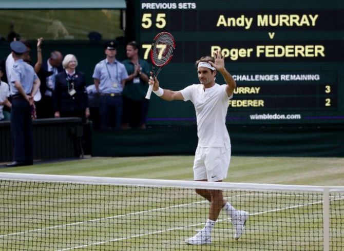 Roger Federer of Switzerland celebrates after winning his match against Andy Murray of Britain at the Wimbledon Tennis Championships