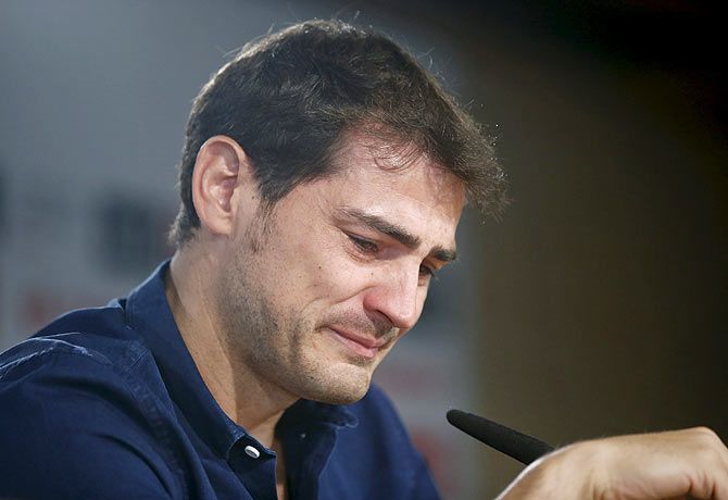 Real Madrid captain and goalkeeper Iker Casillas cries as he reads a statement announcing his departure from the Spanish club at the Santiago Bernabeu stadium in Madrid